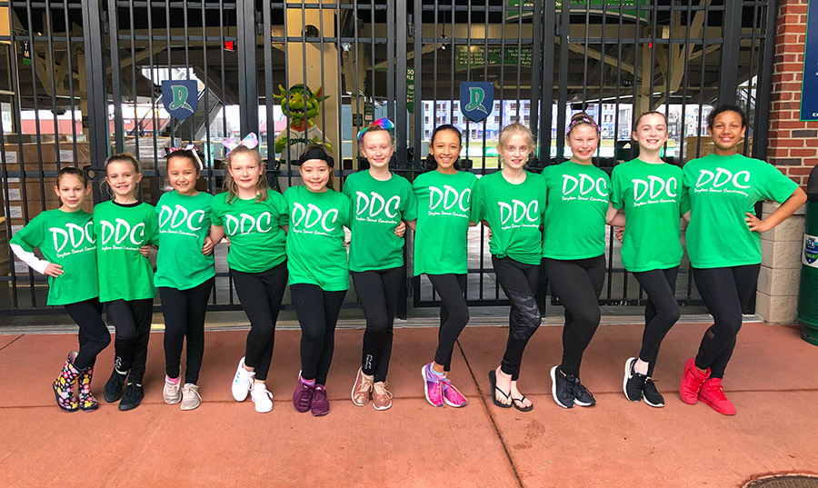 dayton dance conservatory mini dugout dancers posing at Fifth Third Field