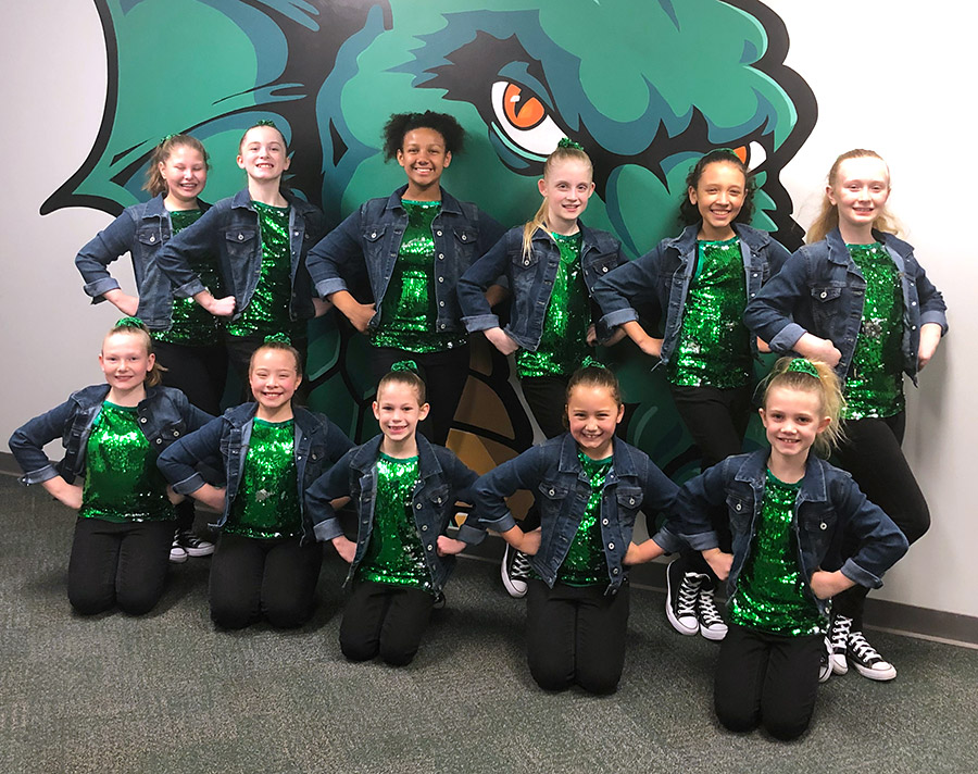 dayton dance conservatory mini dugout dancers posing at Fifth Third Field