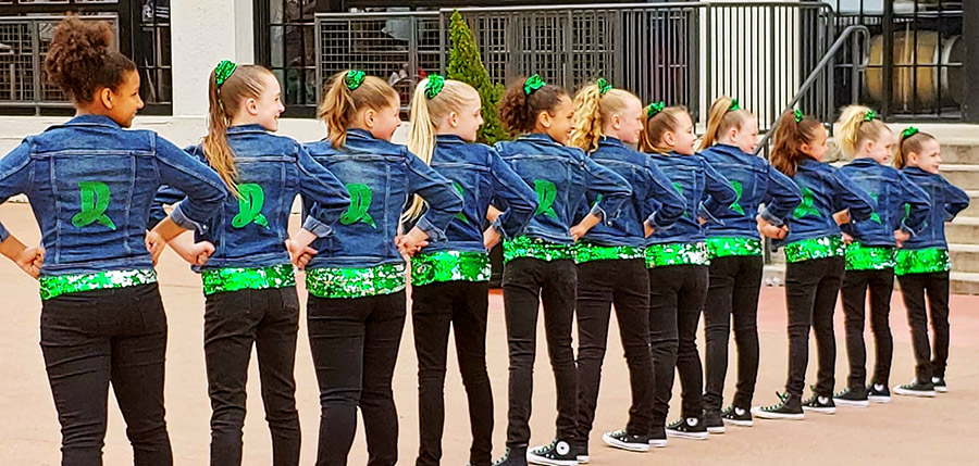 dayton dance conservatory mini dugout dancers posing at Fifth Third Field